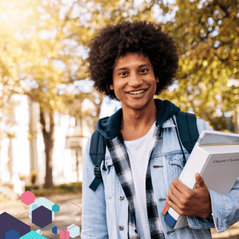 Male college student holding books
