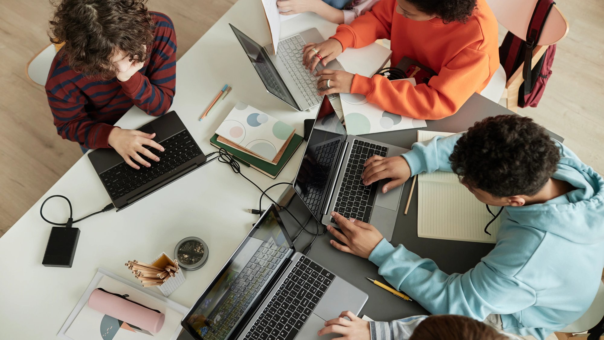 aerial view of students working together on laptops